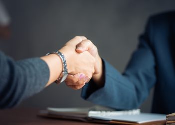 Negotiating business,Image businesswomen handshake,happy with work,business woman she is enjoying with her workmate,Handshake Gesturing People Connection Deal Concept. Vintage effect style pictures.